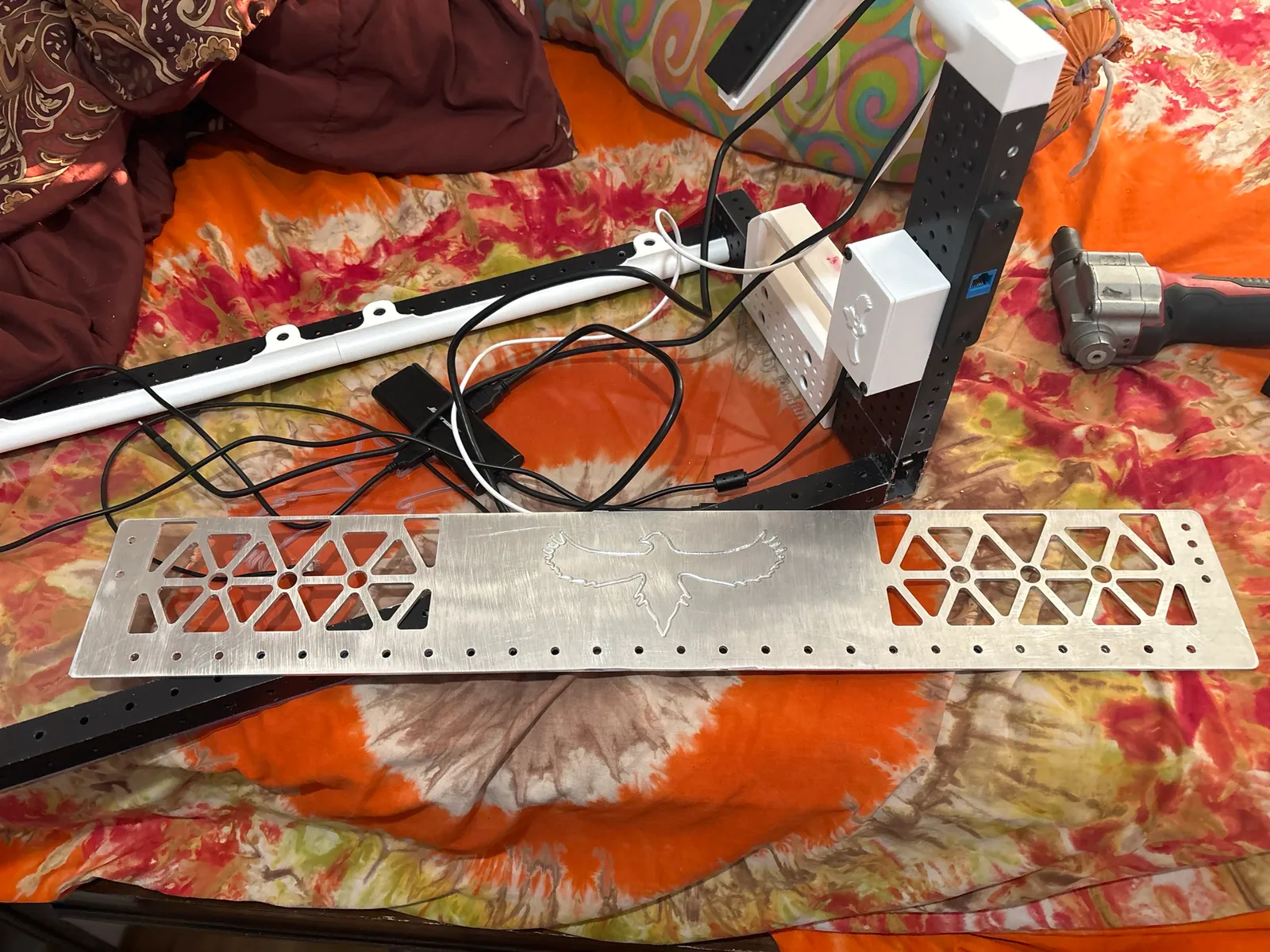 The cut aluminum backplate next to the rest of the station