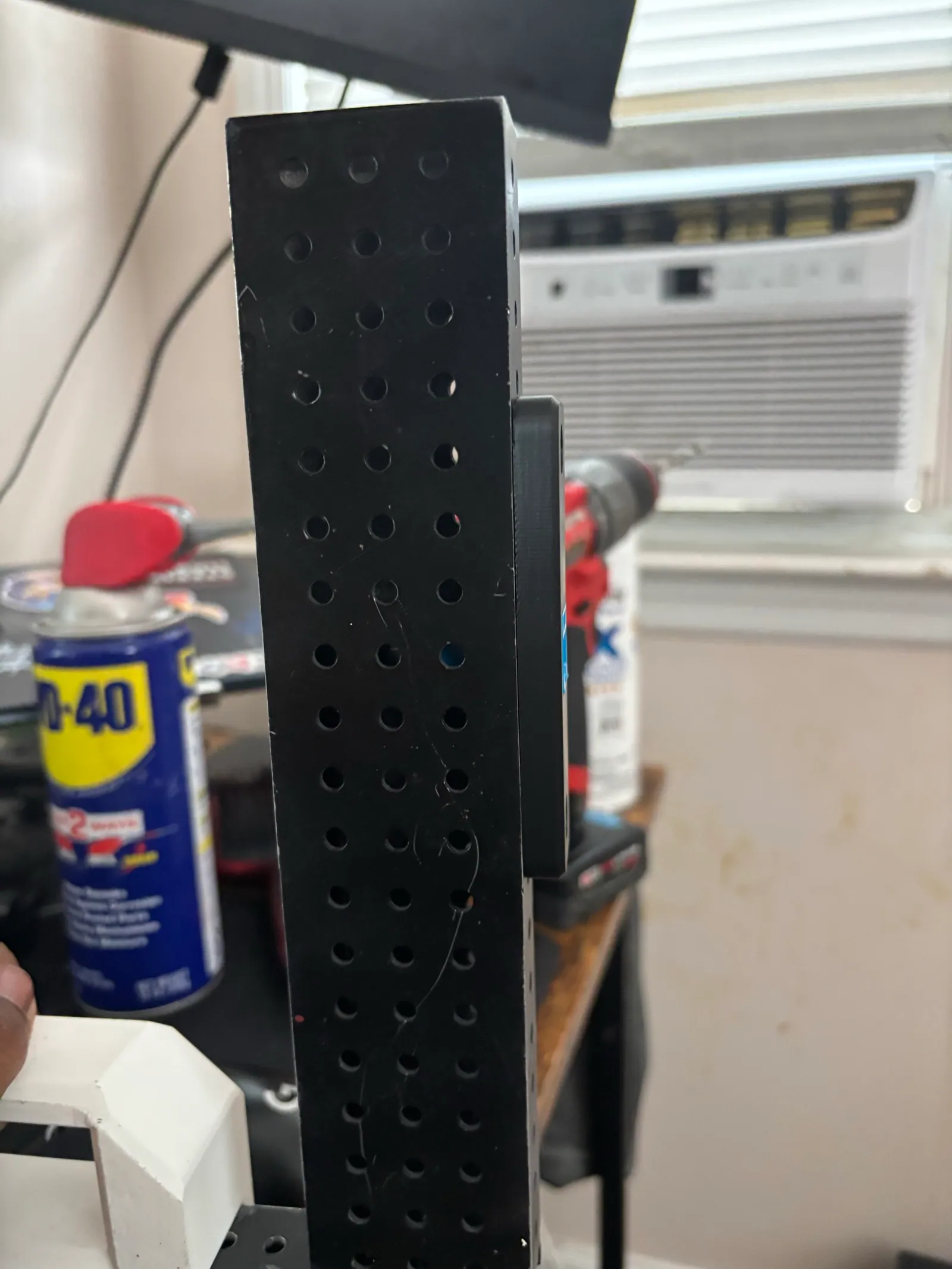 The vertical tube with the Ethernet port mounted
