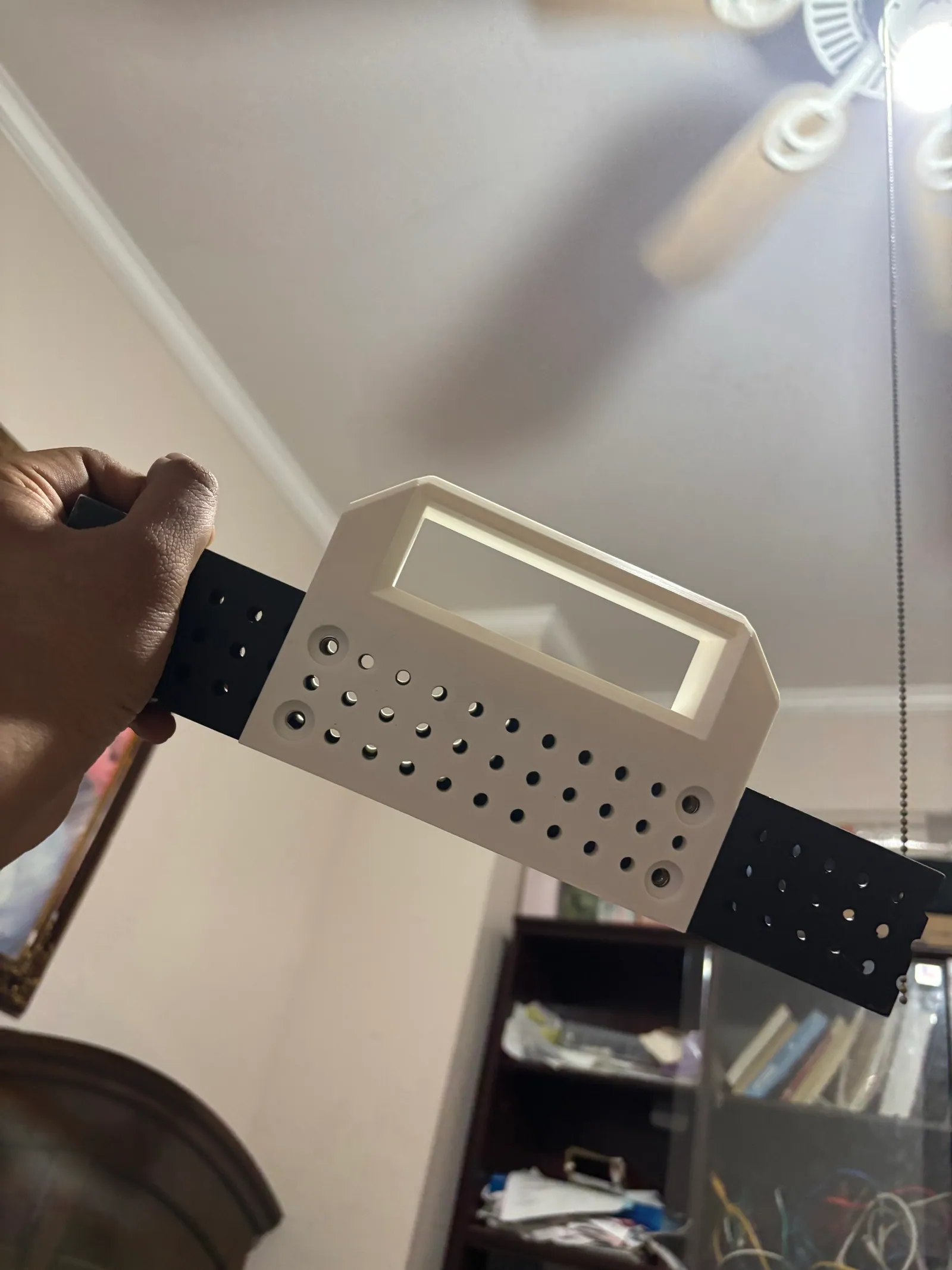 The 3D printed handle bolted onto the black 2x1 tube