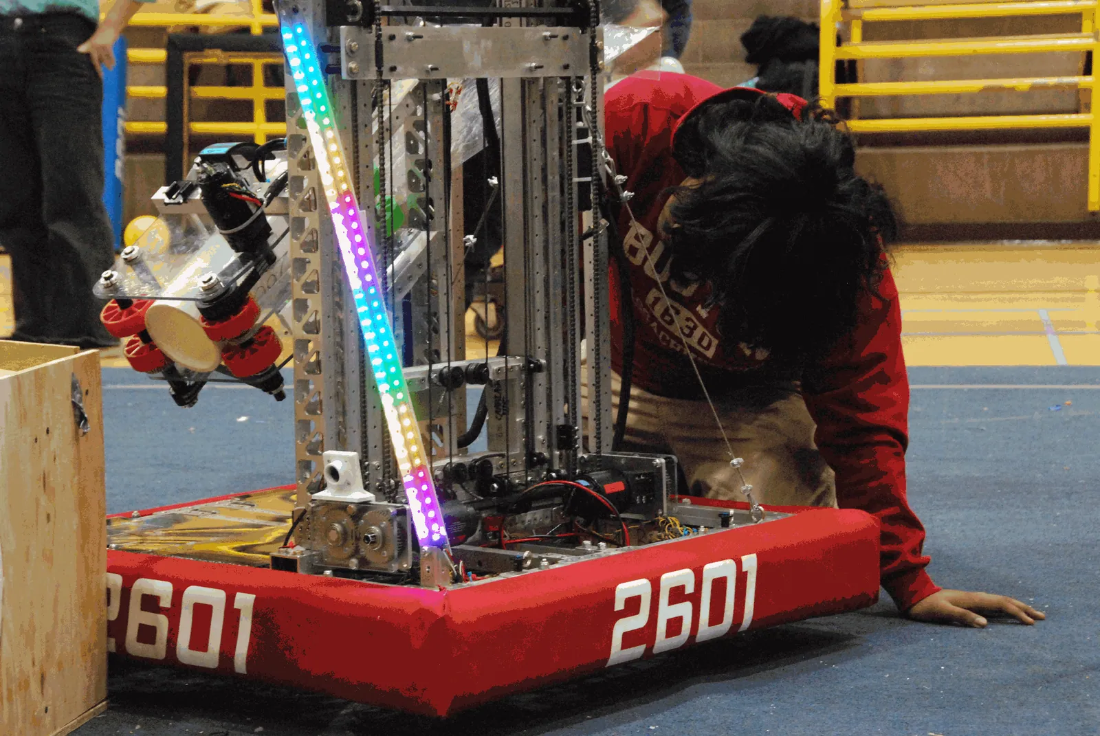 Chimera, Steel Hawks' 2025 competition robot, getting a once-over on the field carpet